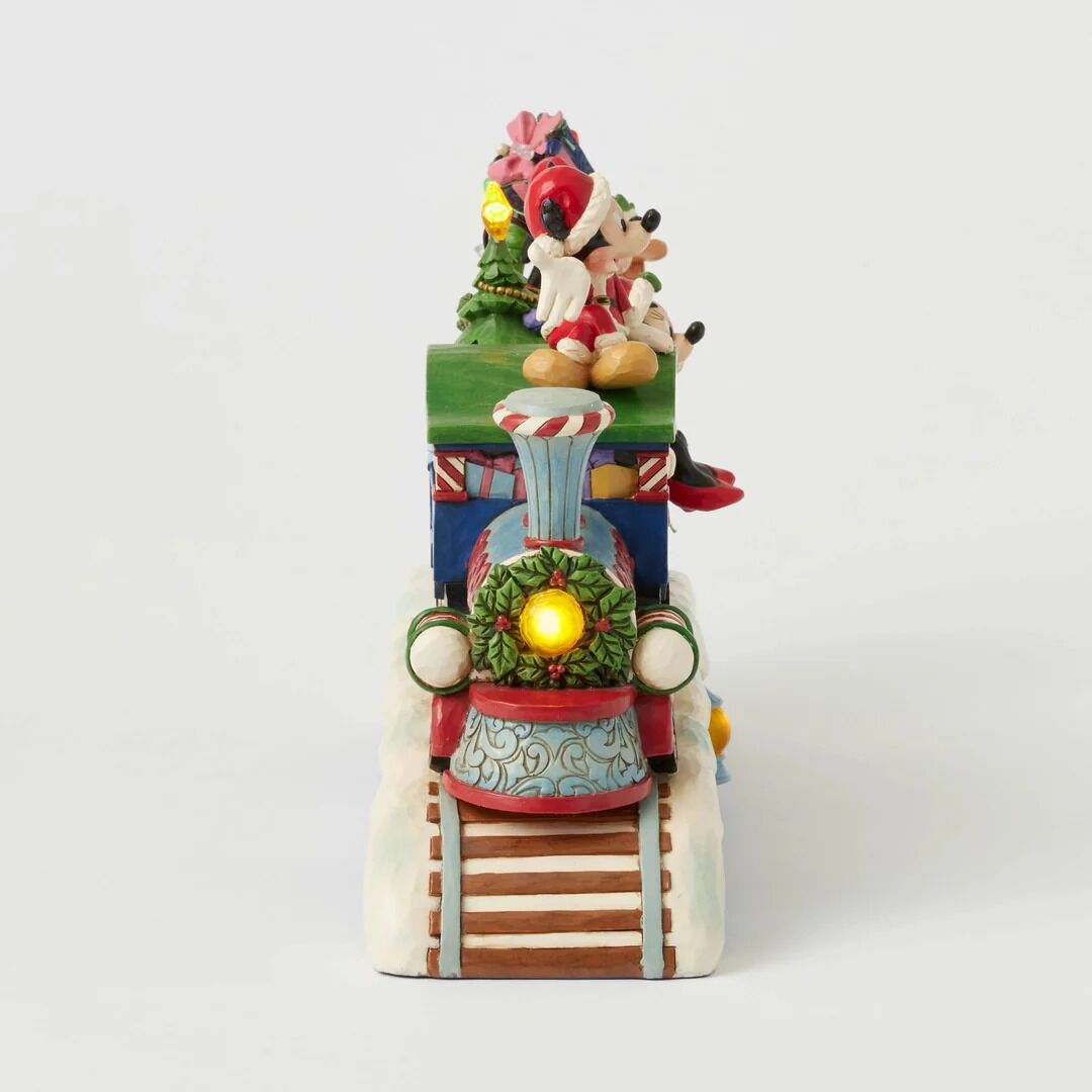 A festive Disney-themed Christmas train figurine featuring Mickey Mouse and Minnie Mouse riding on a decorated train with glowing lights, set against a plain light gray background.
