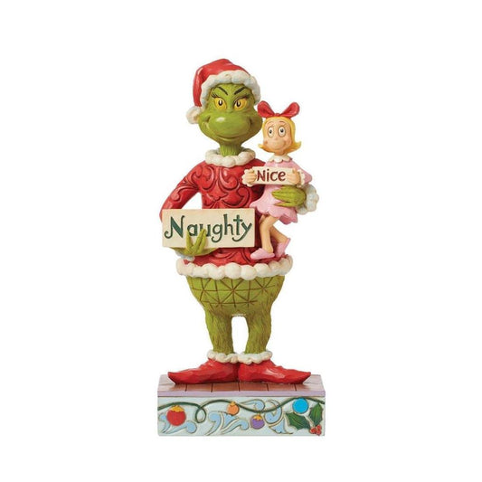 A Grinch-themed Christmas figurine featuring the Grinch in a red Santa outfit holding a sign that says 'Naughty' and a small doll holding a sign that says 'Nice', set on a decorative base against a plain white background.
