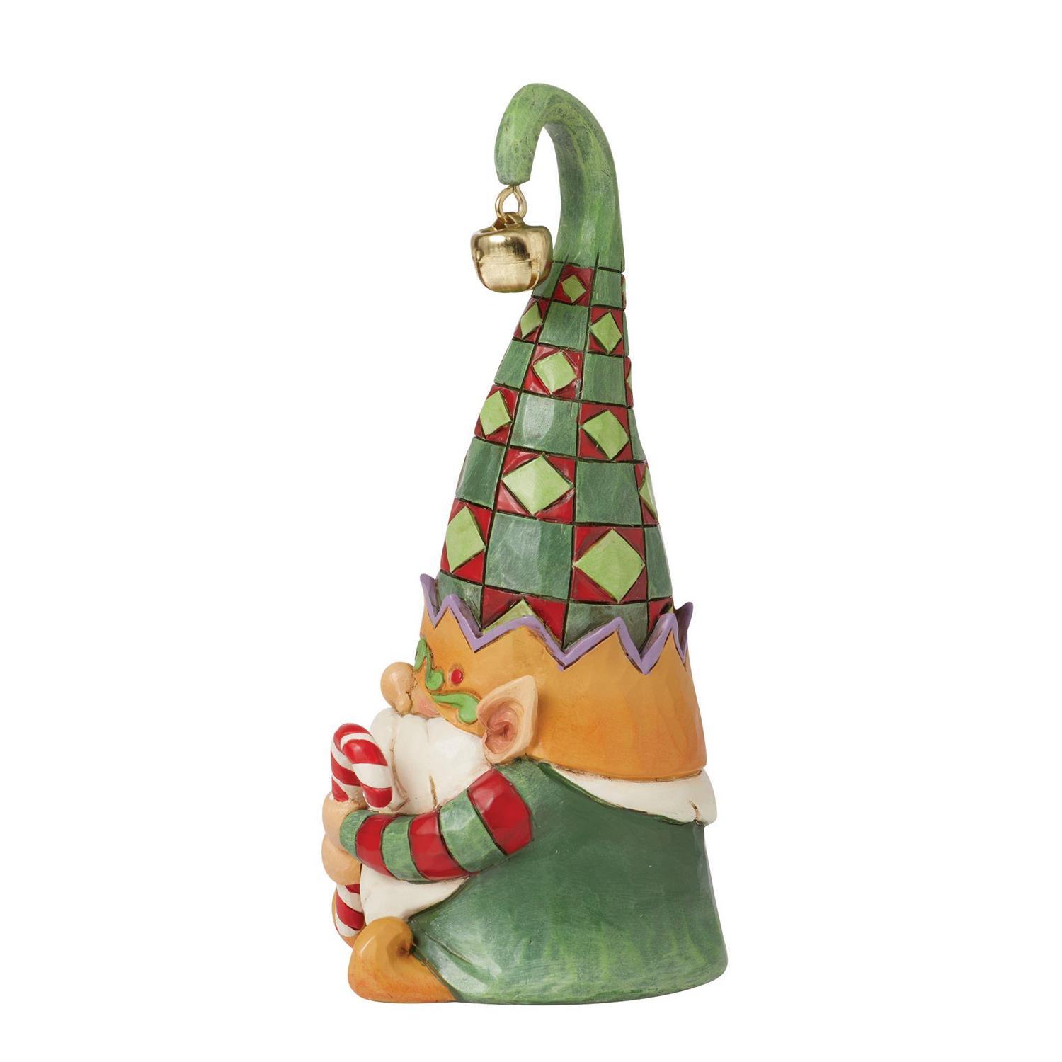 Colorful gnome figurine with a green hat and orange body on a white background