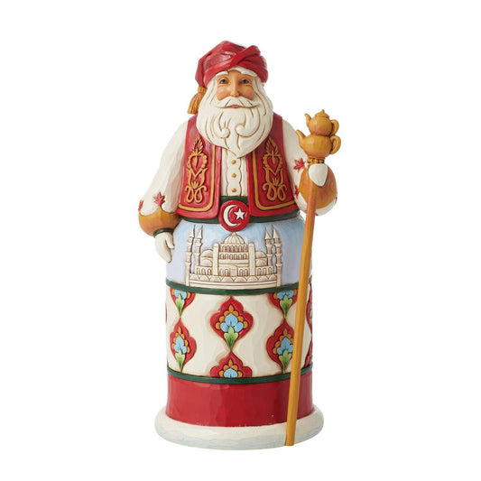 Decorative figurine of a character in traditional attire with a white background