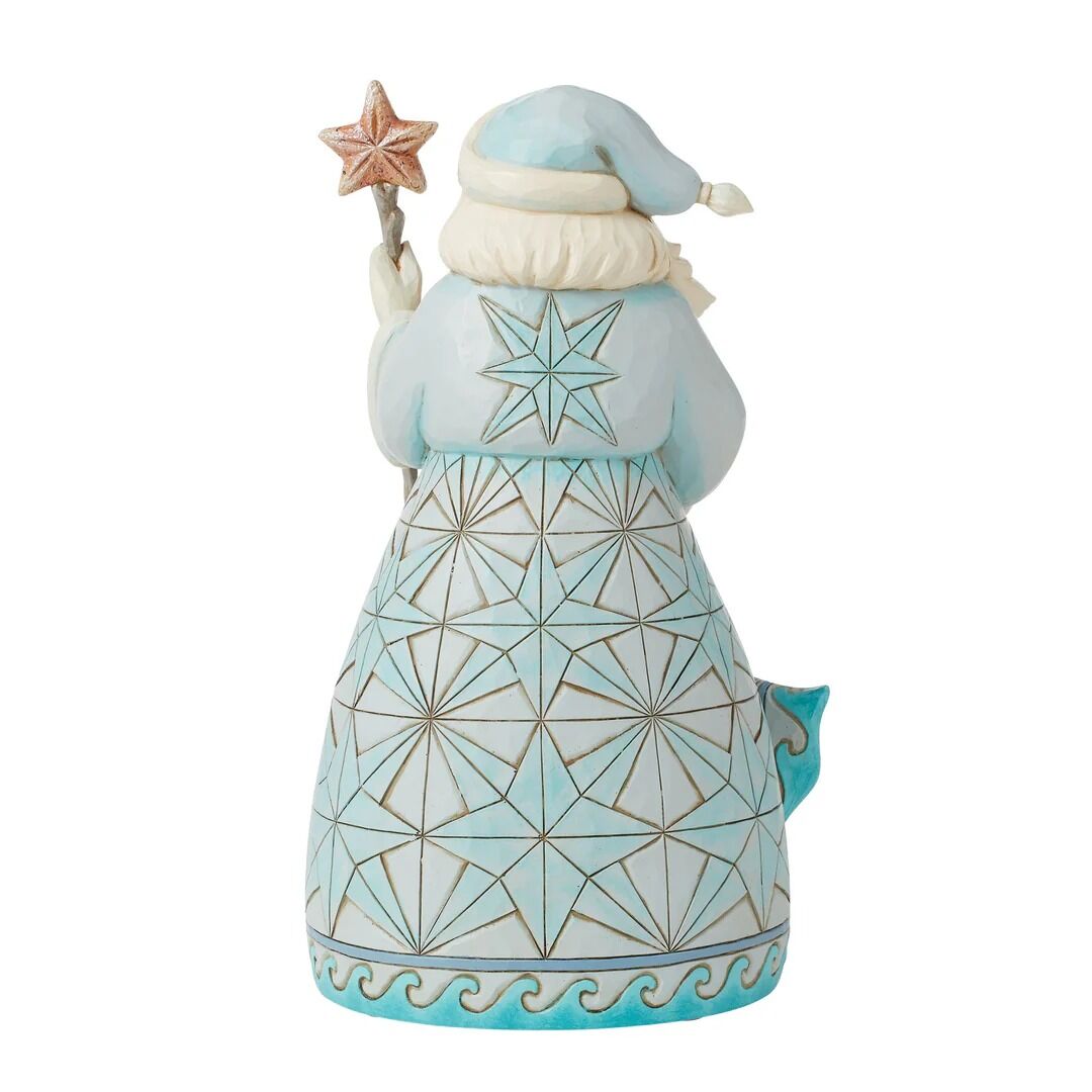 Decorative figurine of a character in a light blue outfit with geometric patterns on a white background