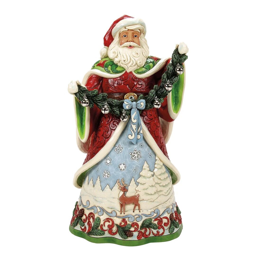 Decorative figurine of Santa Claus with a winter scene design on a white background