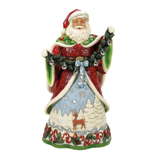 Decorative figurine of Santa Claus with a winter scene design on a white background