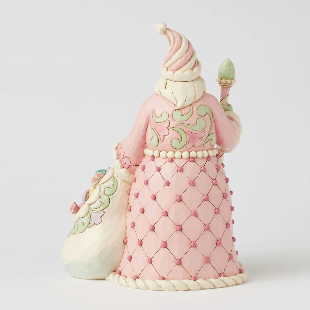 Decorative figure with a pink dress and white hat on a light gray background