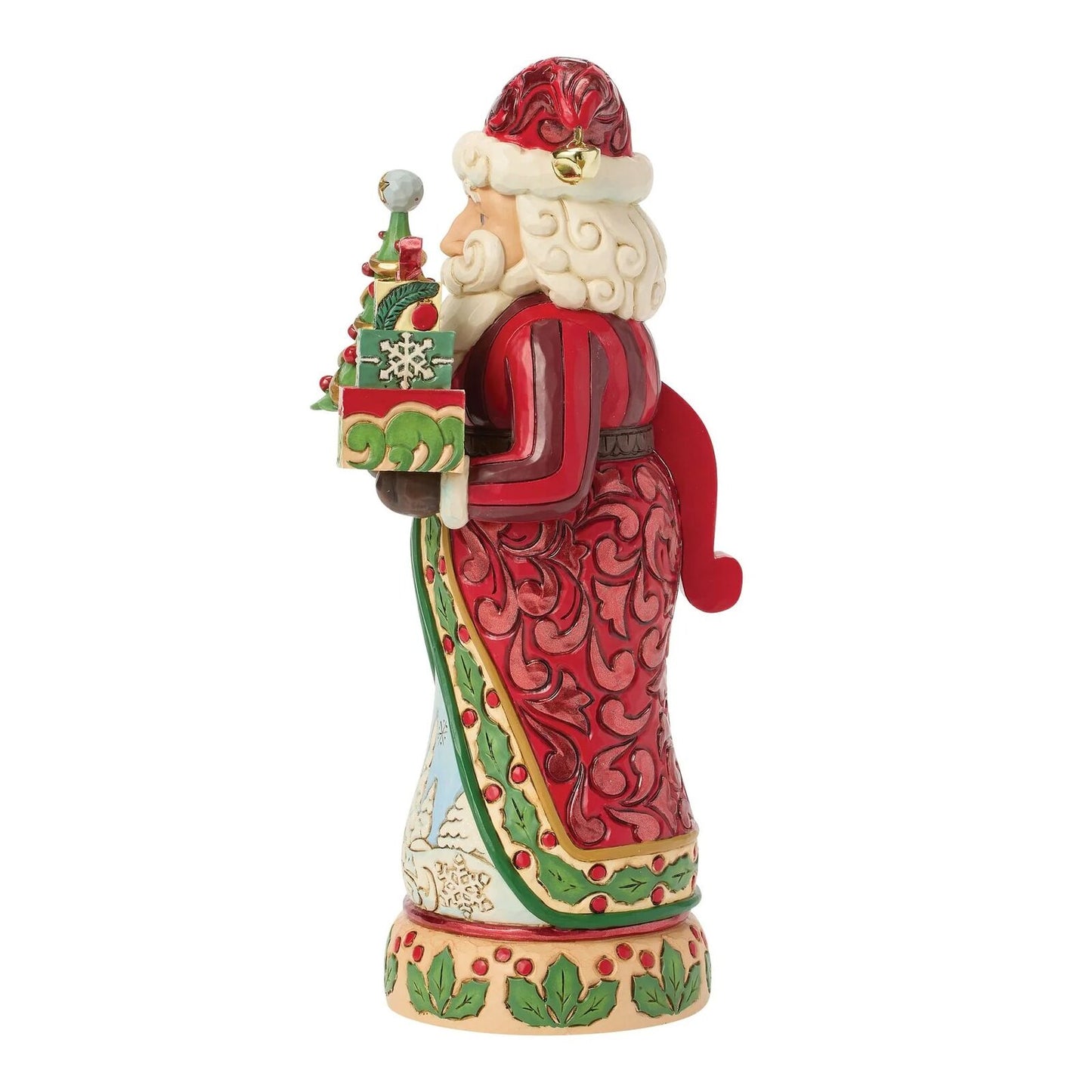 A Santa Claus figurine holding a small decorated Christmas tree and gift box, shown against a plain white background.
