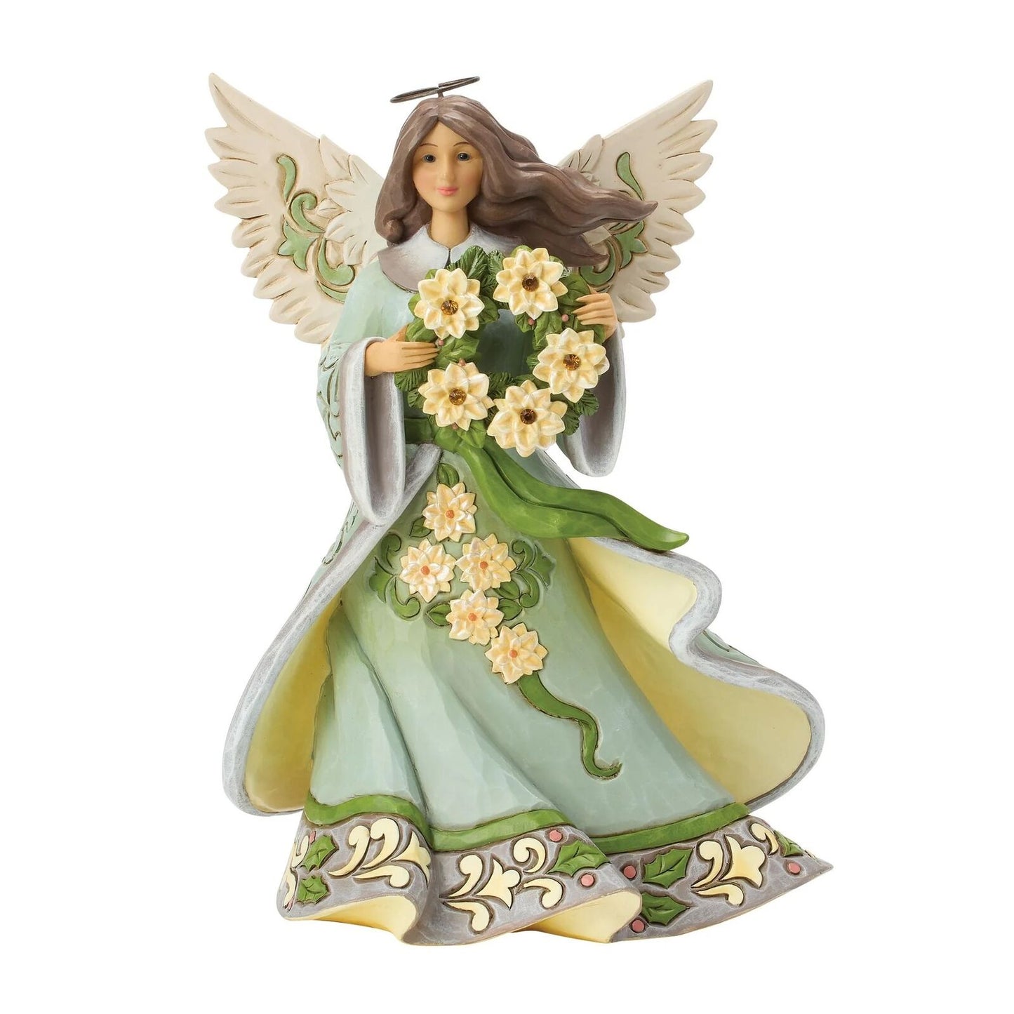 An angel figurine with wings, holding a bouquet of yellow and white flowers, wearing a light green and cream gown with decorative floral patterns.