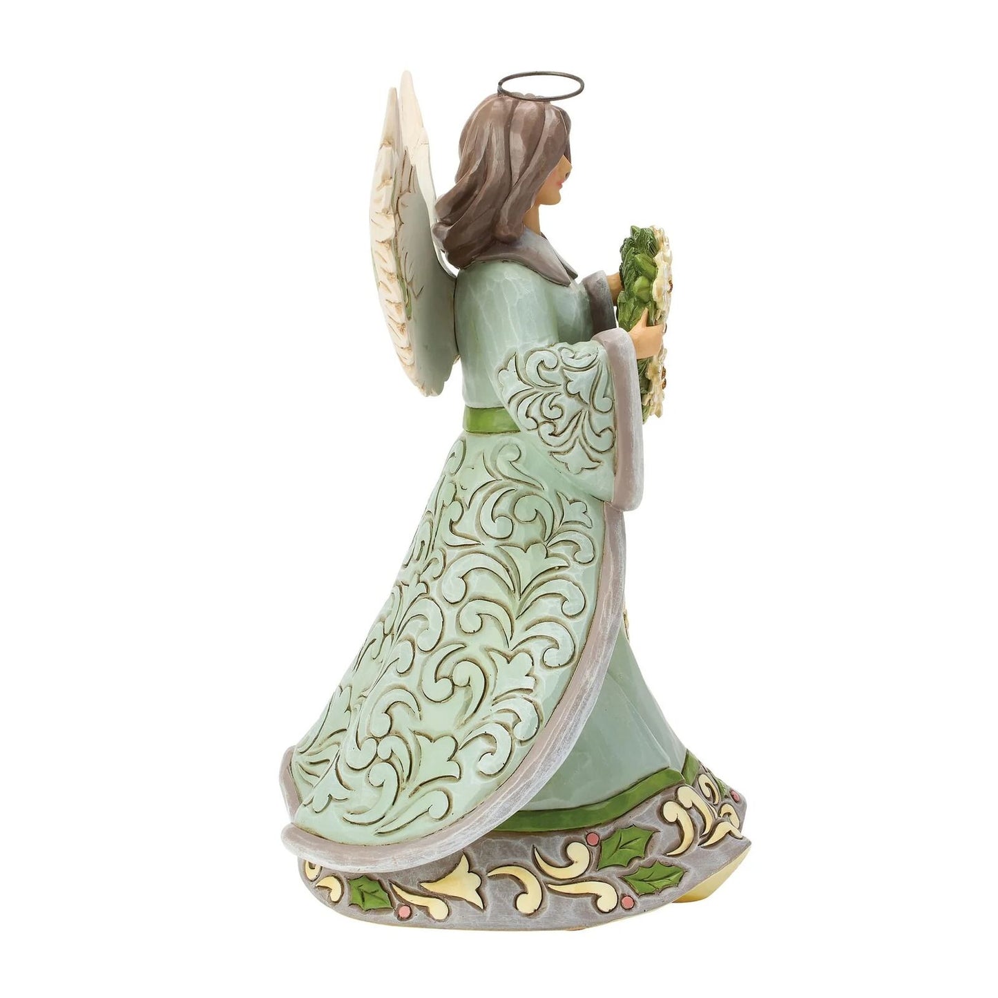A decorative angel figurine shown from the back, wearing a pale mint green robe with ornate gold scrollwork, a brown halo, and holding a bouquet of green leaves against a plain white background.
