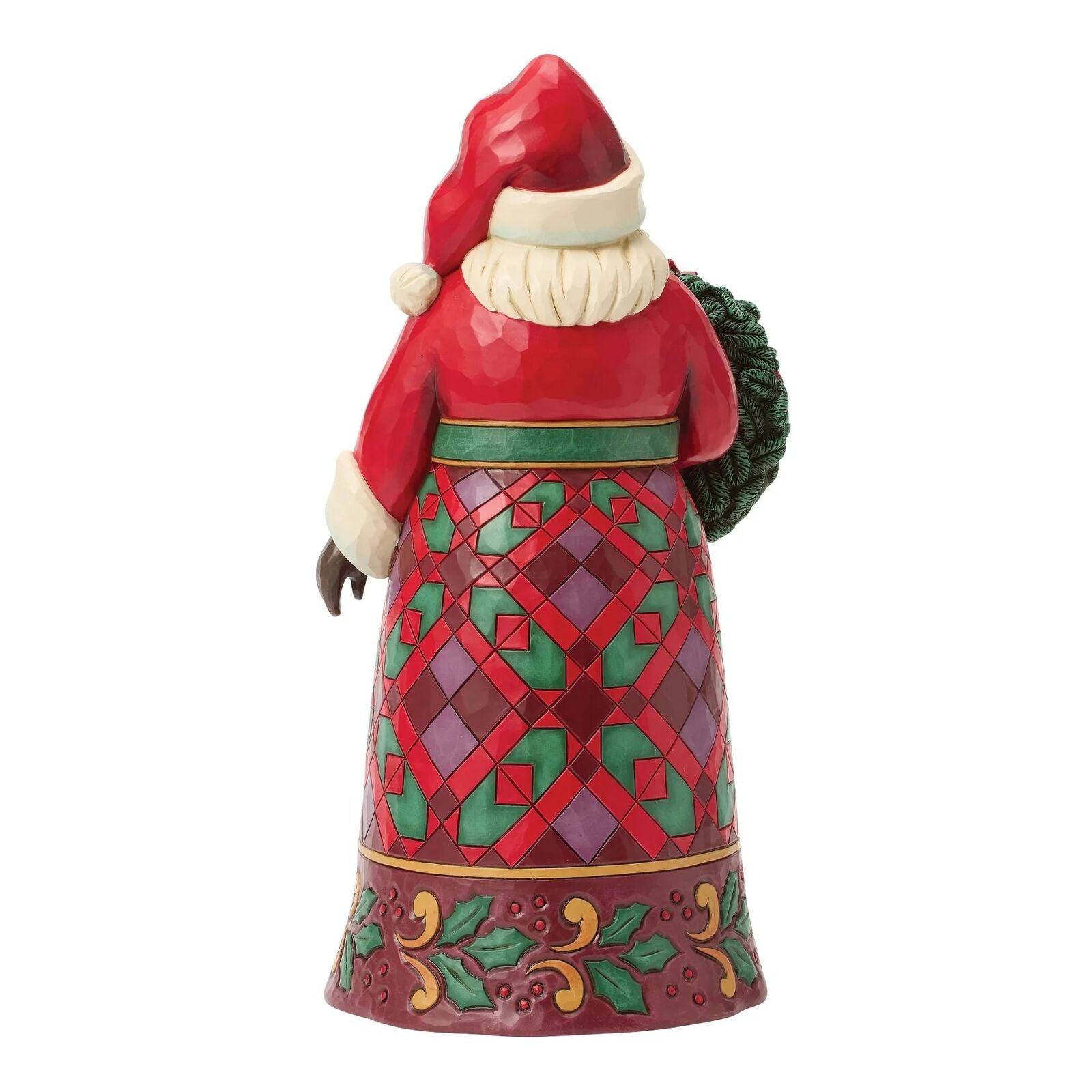 Decorative Santa figurine with a red and green patterned dress on a white background