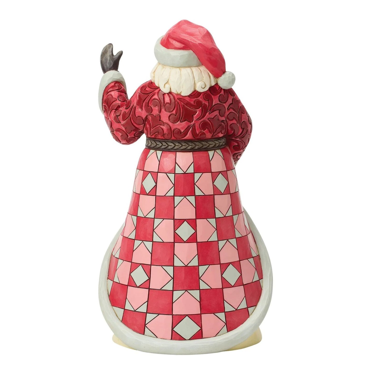 Decorative figurine of a character in a red and pink patterned outfit on a white background