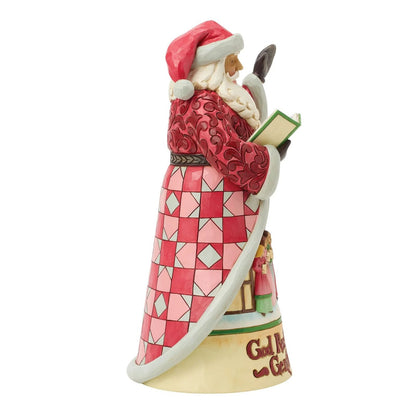 Santa Claus figurine with a red and white checkered pattern on a white background