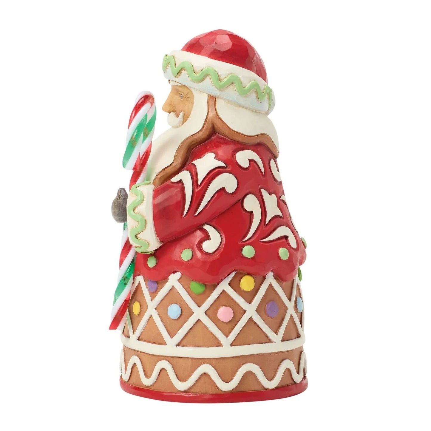 Decorative gingerbread man figurine with candy cane on a white background
