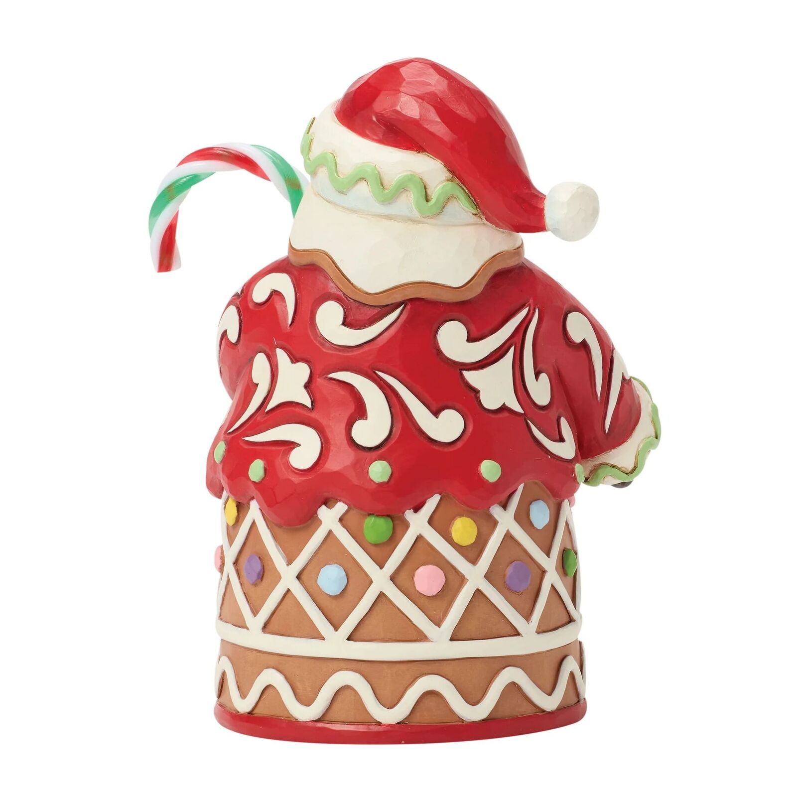 Decorative gingerbread cookie with a Santa hat and candy cane on a white background
