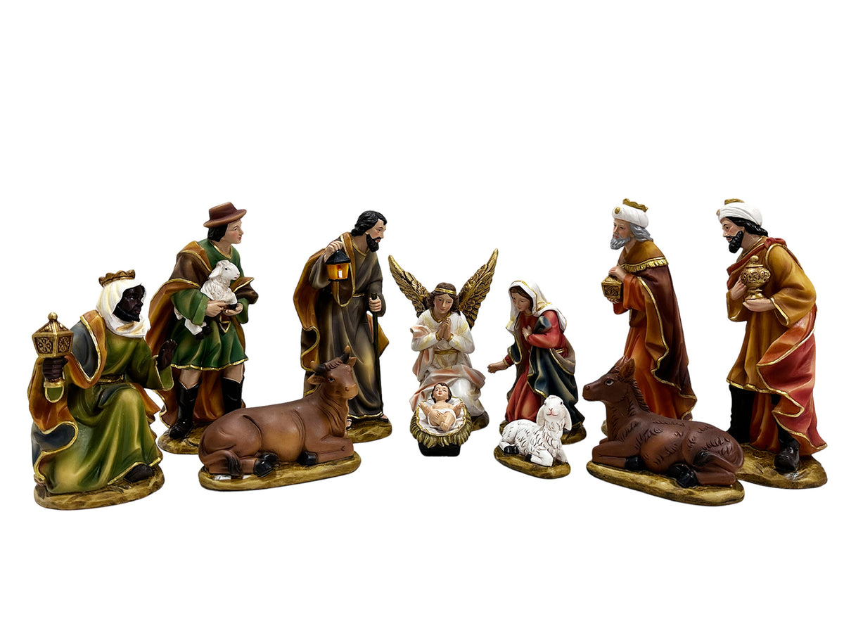 A 11-piece nativity set figurines on a plain white background. The set includes Mary, Joseph, the baby Jesus, an angel, three wise men, a cow, a sheep, and a donkey, all detailed with traditional robes and painted skin tones.