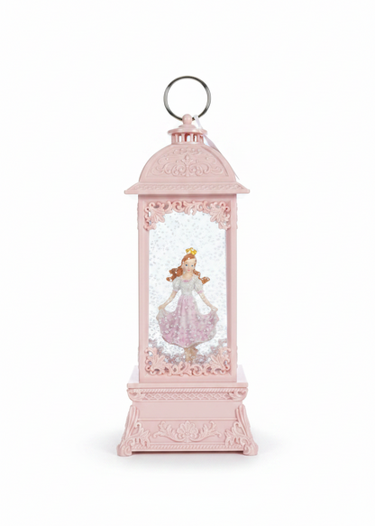 A pink decorative lantern-style ornament with a printed princess figure inside
