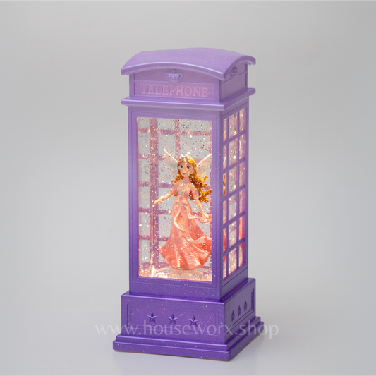 Purple telephone booth with a fairy in a pink dress on a gray background