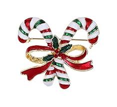 Christmas-themed candy cane and bow brooch on a white background