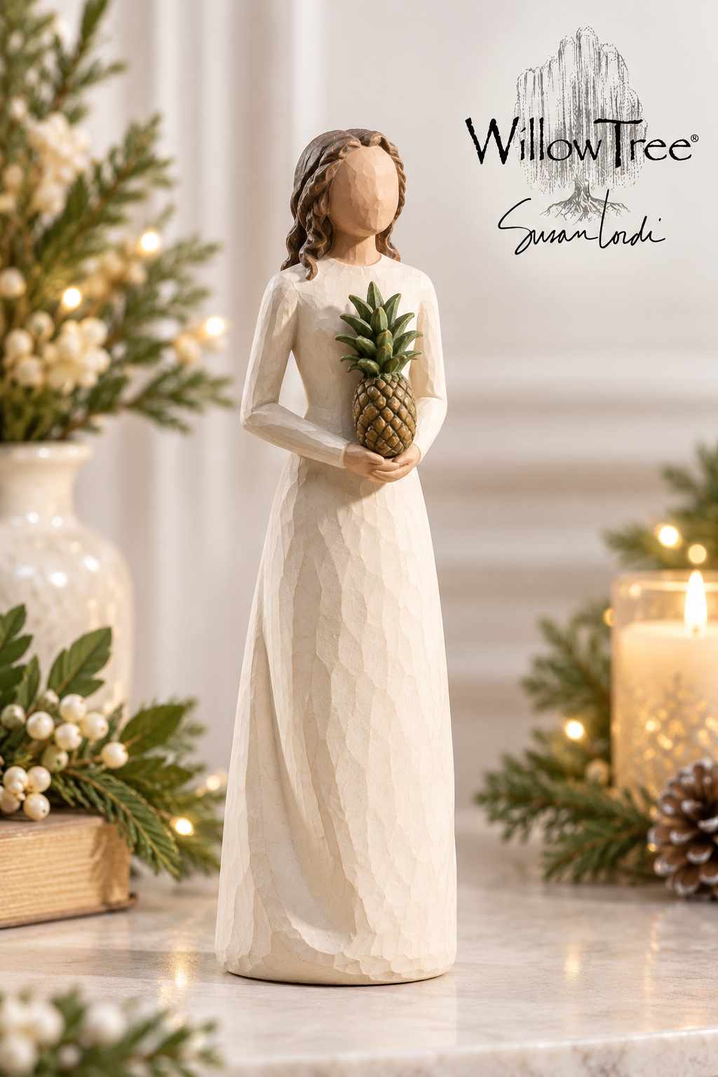 A WillowTree 'Summer Lady' figurine stands on a marble surface, holding a pineapple. The figurine is dressed in a long cream-colored gown.