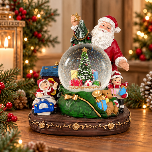 A festive Christmas snow globe figurine set on a wooden table, featuring Santa Claus, a small tree, gift boxes, and holiday characters, with blurred Christmas decorations in the background.