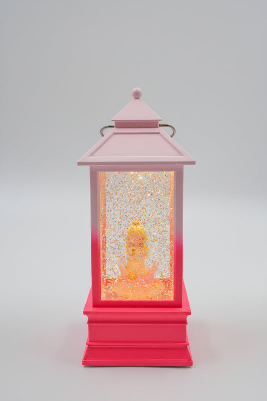 A decorative lantern with a pink frame and a red base, filled with glittering gold and orange internal elements, shown against a plain light gray background.