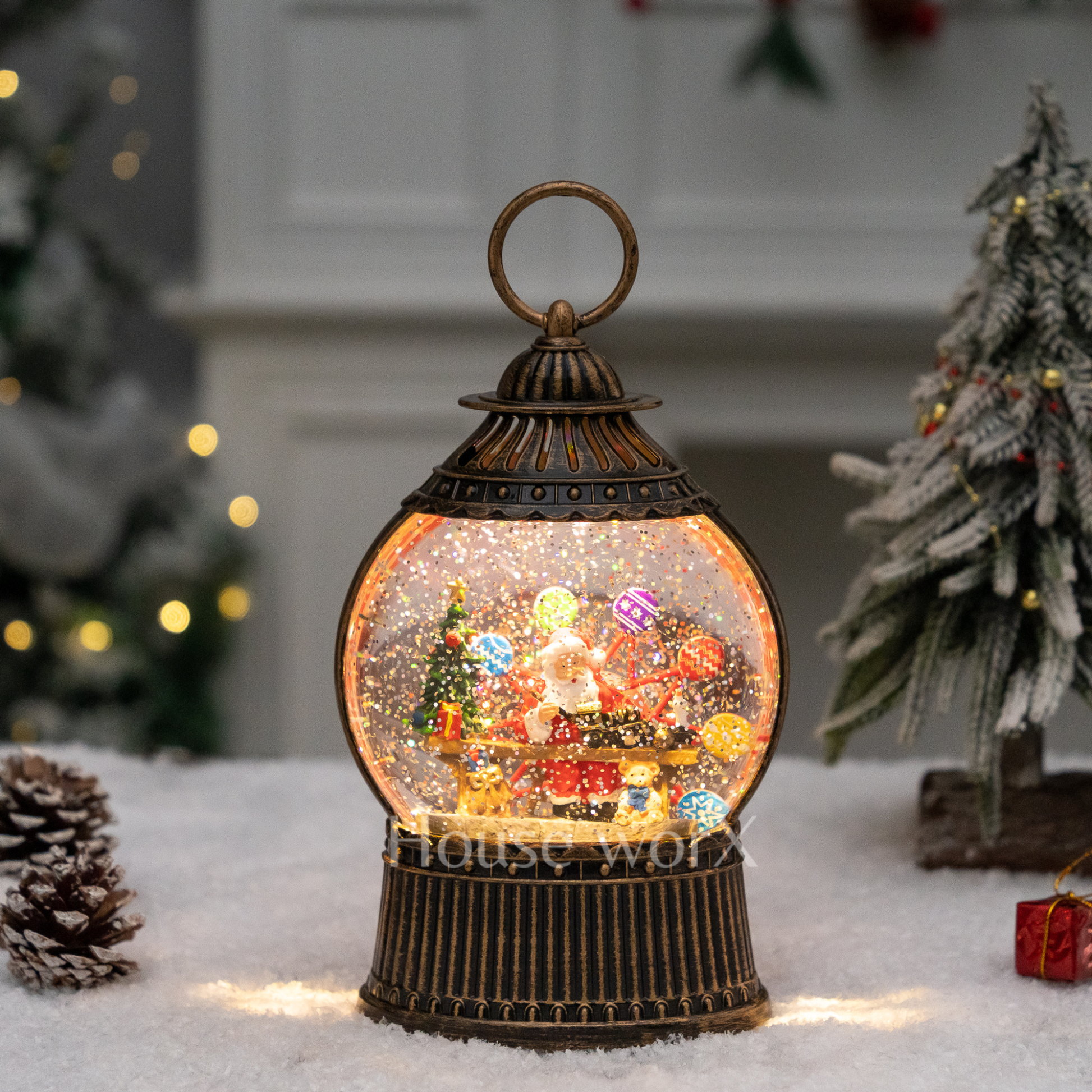 Decorative snow globe with Christmas scene inside, surrounded by festive decorations.