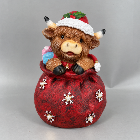 Highland Cow in Santa Sack Figurine