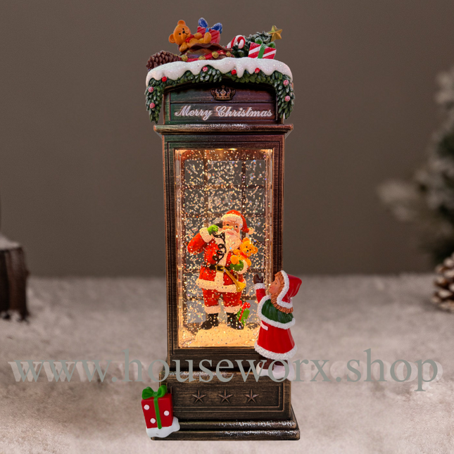 Festive telephone booth christmas snow globe