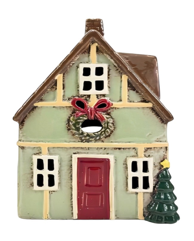 Decorative house ornament with a wreath and doorbell on a white background