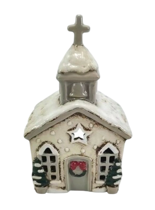 Decorative miniature church with a star on the front, white roof, and bell tower.
