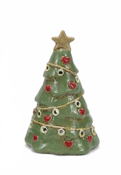 Small ceramic Christmas tree figurine with red hearts and a gold star on a white background