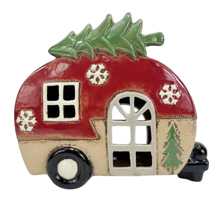 Decorative ceramic camper with Christmas tree and snowflakes on a white background