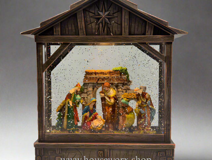 manger bronze christmas snow globe
