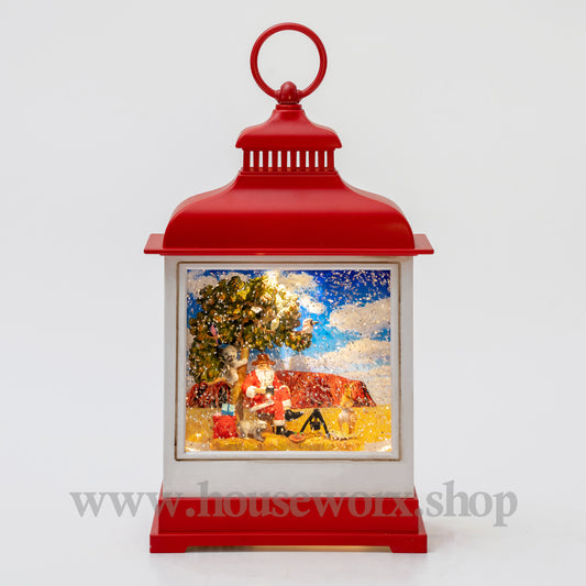 Red lantern with a Christmas scene inside on a white background
