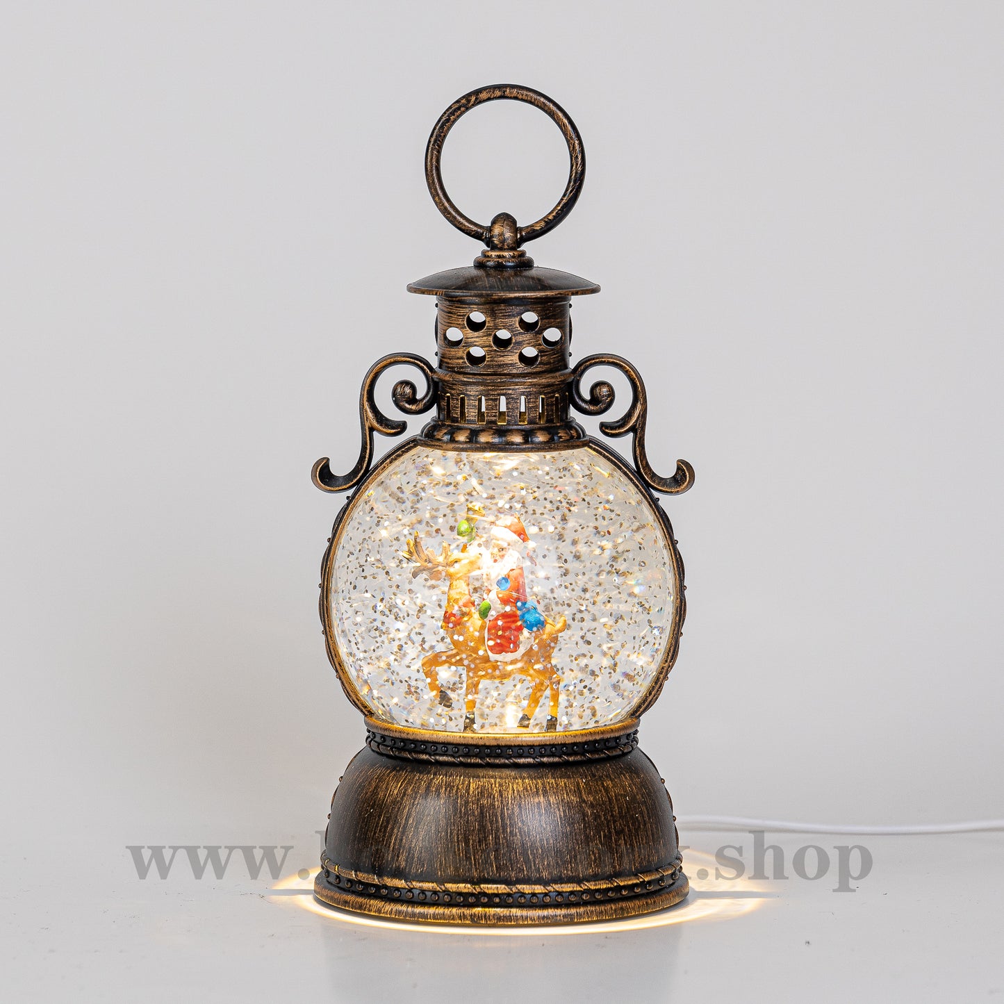 Palace santa and reindeer christmas snow globe front