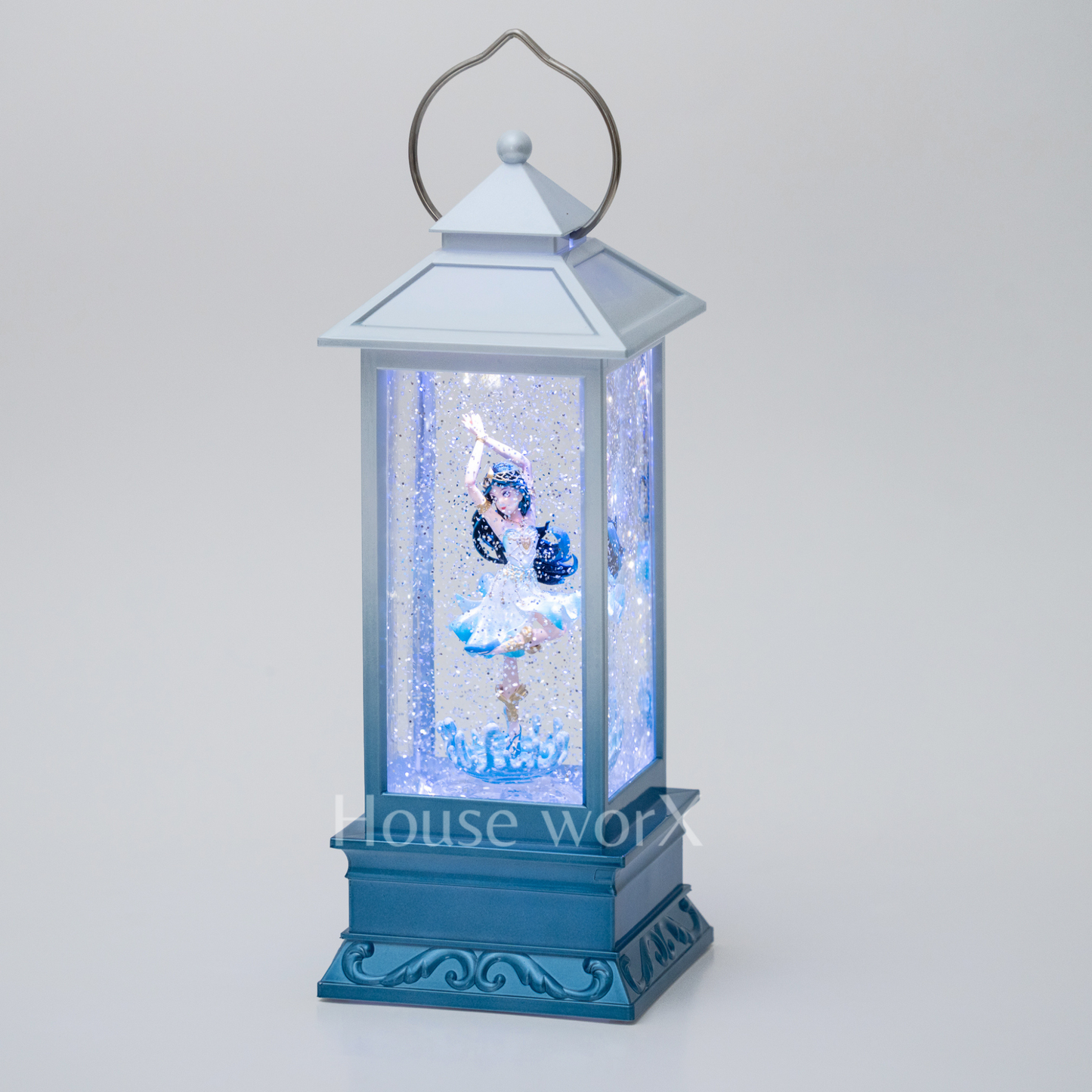 Decorative blue lantern with a snow globe effect on a white background