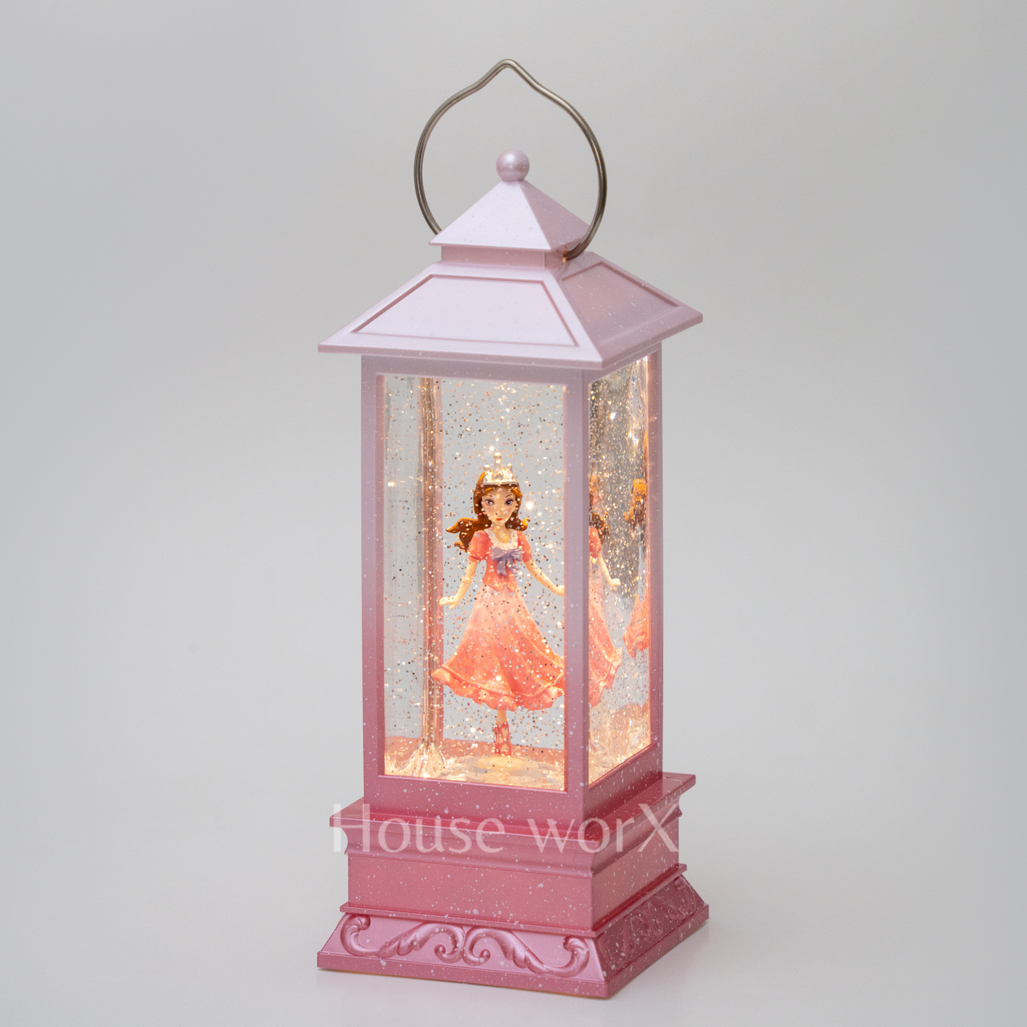 Pink lantern with a princess doll inside on a white background snow globe