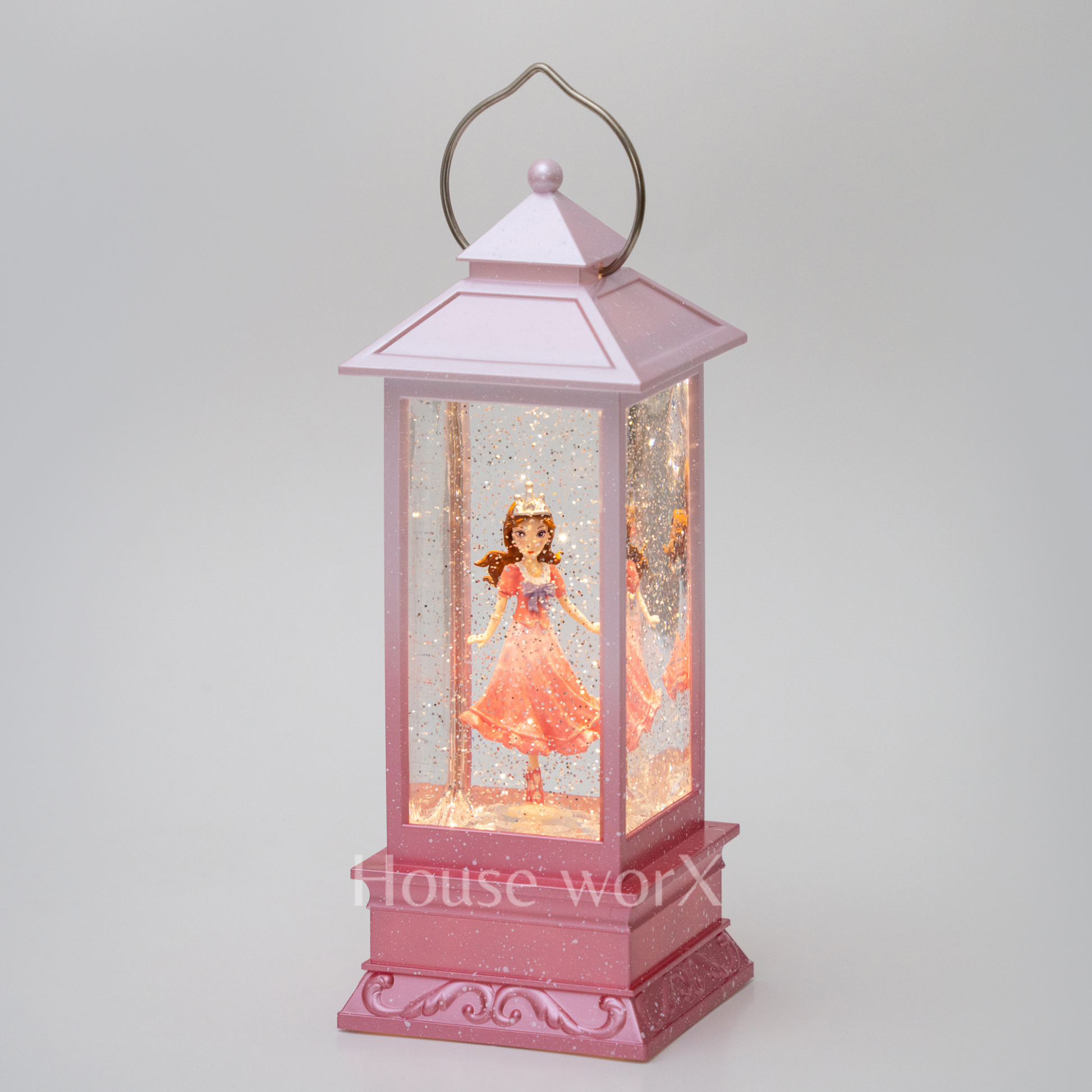 Pink lantern with a princess doll inside on a white background snow globe