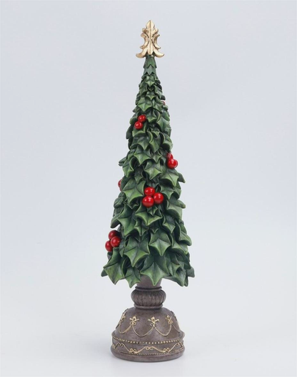 A decorative miniature Christmas tree with green holly leaves, red berries, and a gold star topper, mounted on an ornate dark pedestal base against a light gray background.