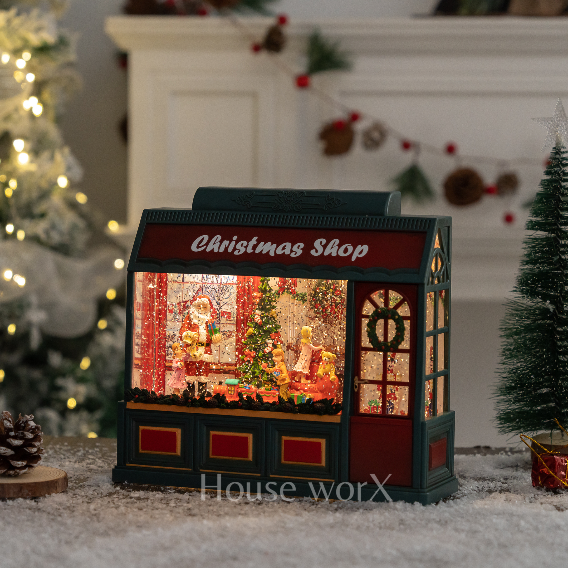 Decorative Christmas shop snow globe light box with Santa Claus scene in a festive setting.
