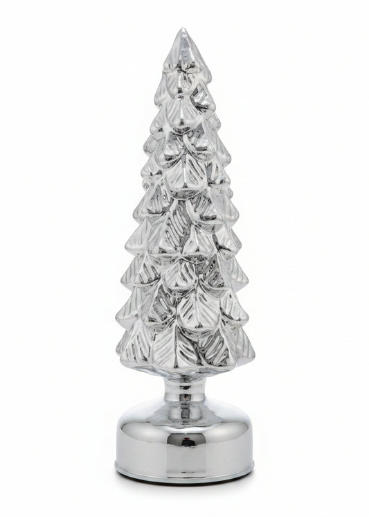 A small metallic silver Christmas tree figurine with a textured, glittery finish and a round base