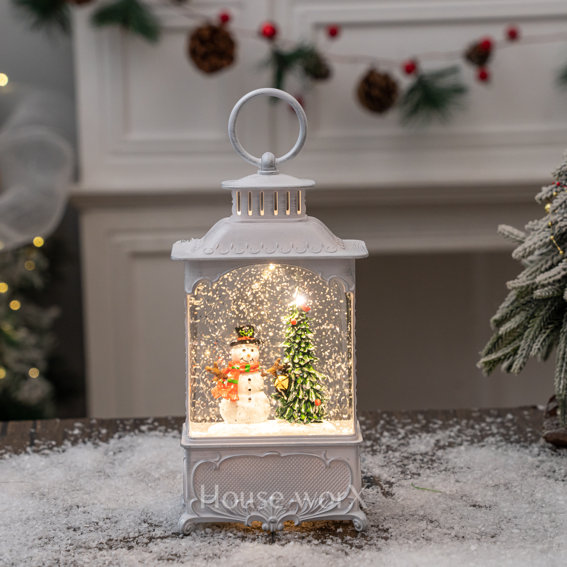 Decorative snow globe with a snowman and Christmas tree inside, placed on a surface with a festive background.