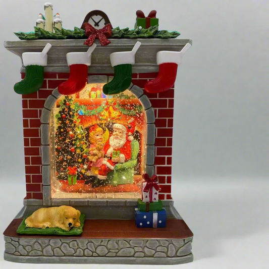 Decorative Christmas scene with Santa Claus, dog, and stockings on a fireplace. chrismas snow globe