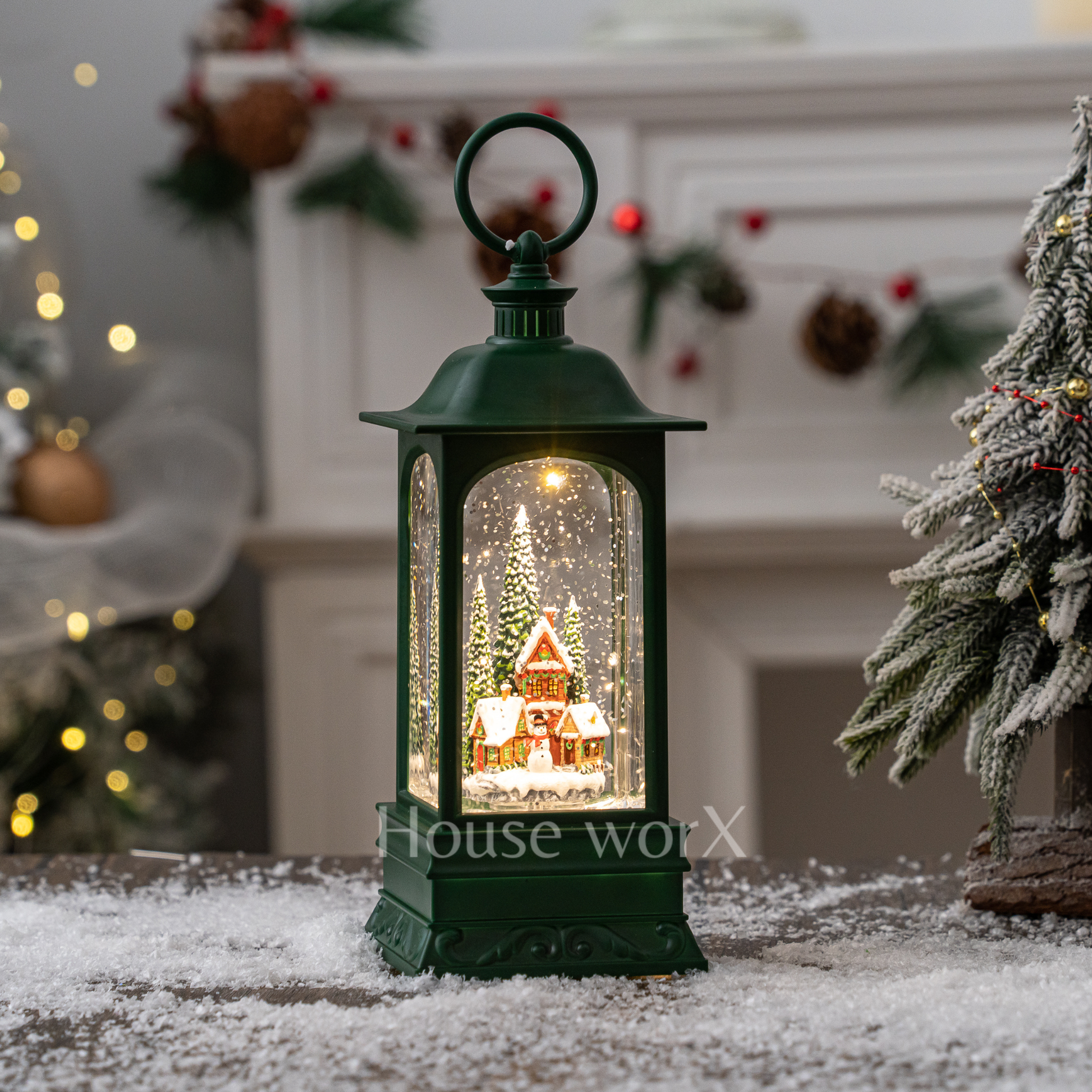 Decorative lantern with a Christmas scene inside, placed on a snowy surface with festive background.