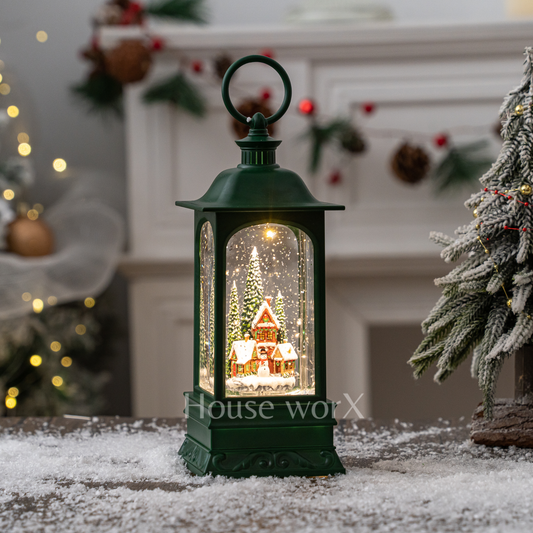 Decorative lantern with a Christmas scene inside, placed on a snowy surface with festive background.
