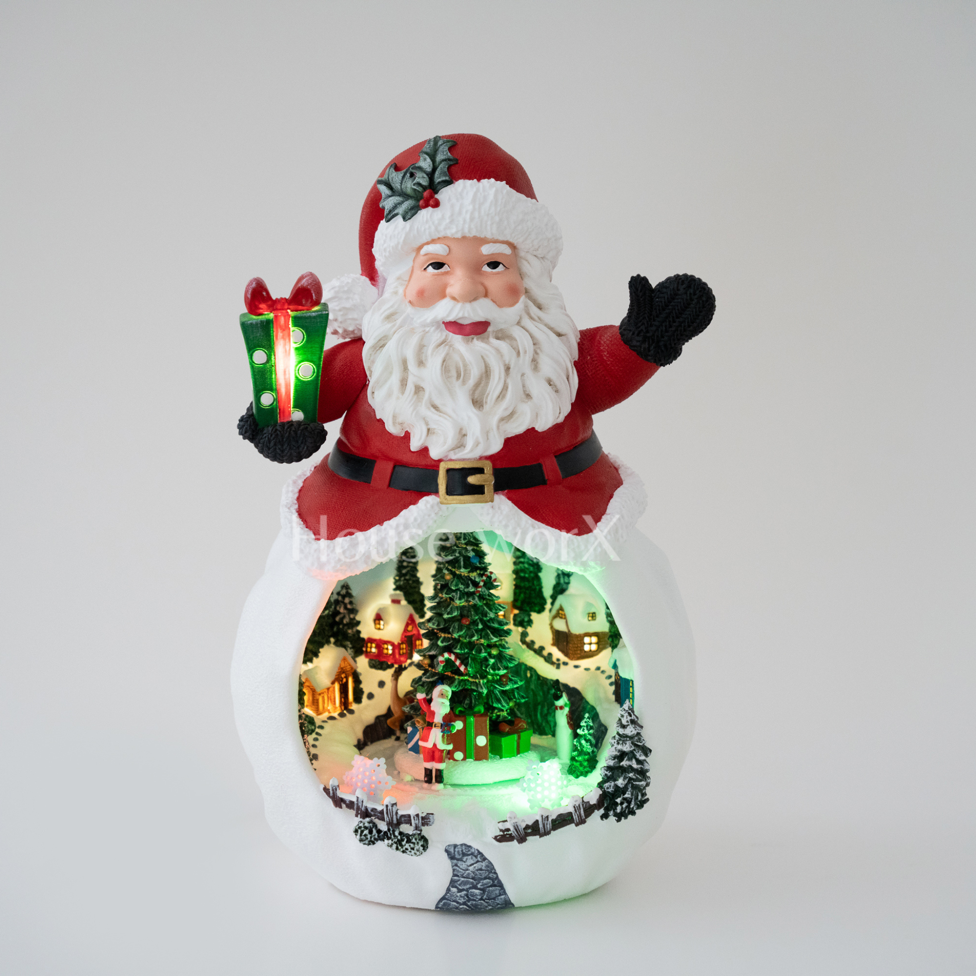 Decorative snow globe with Santa Claus holding a gift, featuring a Christmas scene inside.