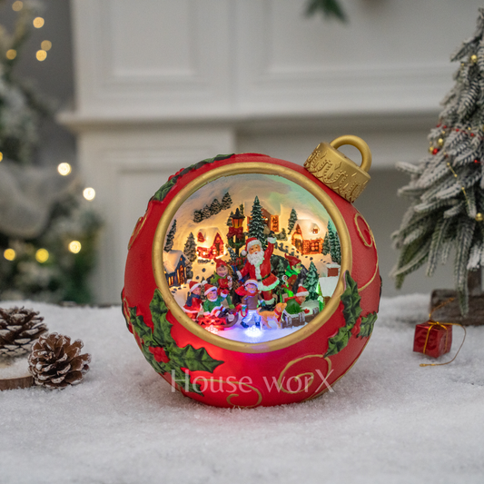 Decorative Christmas ornament with a scene of Santa Claus and children, featuring the brand 'House of WOPX'.