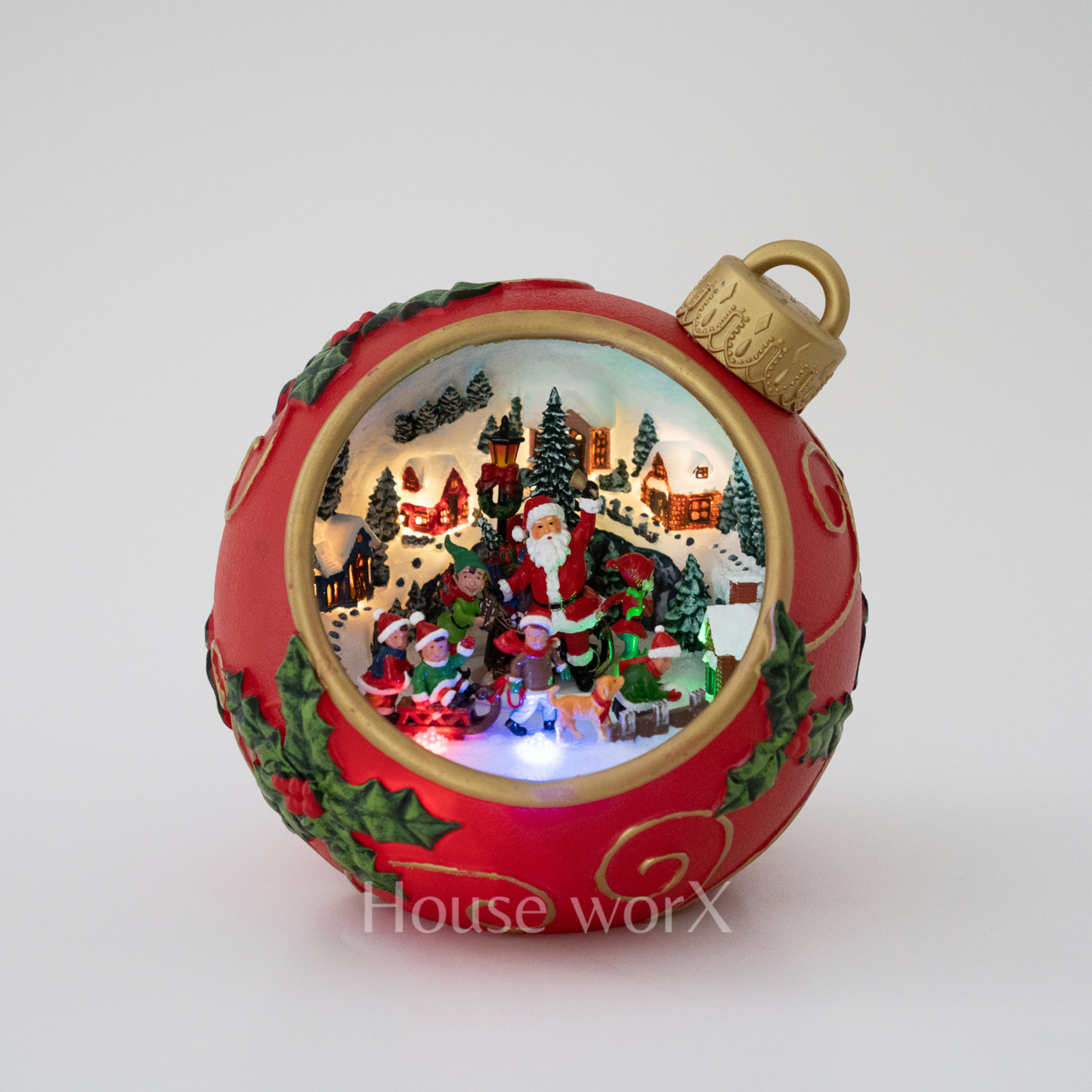 Decorative Christmas ornament with a scene of Santa Claus and children, featuring intricate details and a gold top.