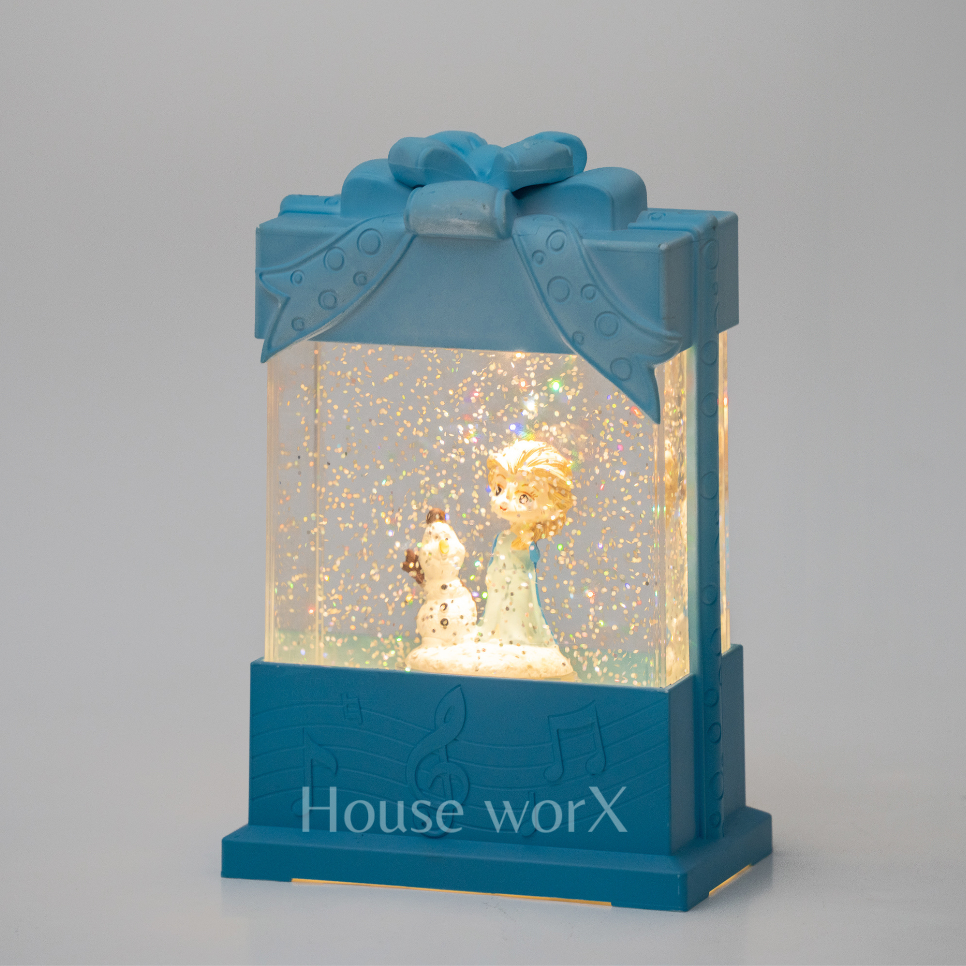 Decorative snow globe present shape with characters inside, featuring 'House worX' branding.