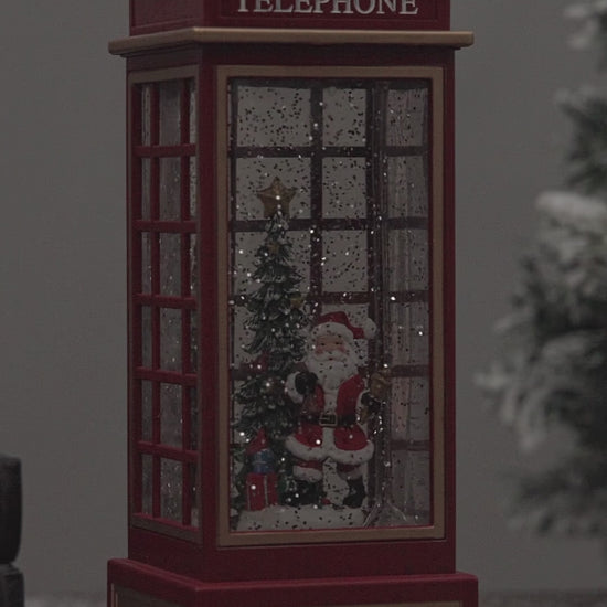 telephone booth christmas snow globe santa
