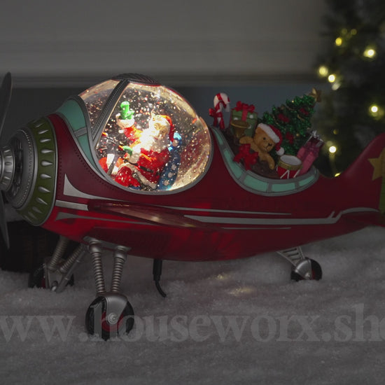 Festive plane snow globe santa video