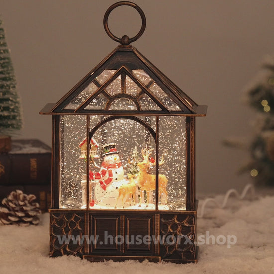 stable christmas snow globe santa video